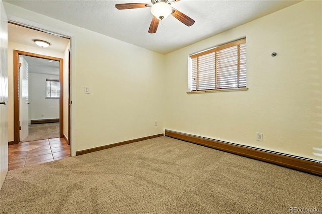 1045 N Clarkson St Unit 102, Denver, CO 80218 - unfurnished room featuring a baseboard radiator, carpet floors, healthy amount of natural light, and a ceiling fan