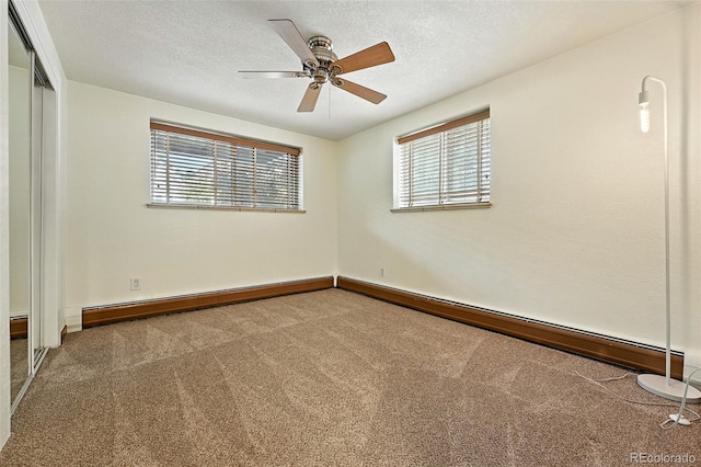 1045 N Clarkson St Unit 102, Denver, CO 80218 - carpeted spare room with healthy amount of natural light, ceiling fan, baseboard heating, and a textured ceiling