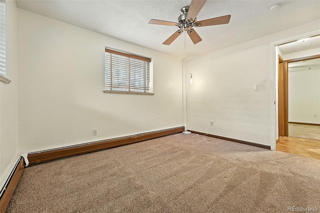 1045 N Clarkson St Unit 102, Denver, CO 80218 - empty room featuring light colored carpet, a baseboard radiator, a smoke detector, and a ceiling fan