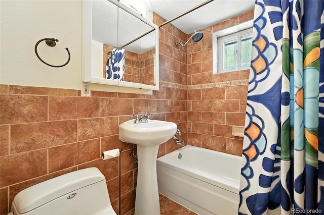 1045 N Clarkson St Unit 102, Denver, CO 80218 - full bath with tile walls and shower / tub combo with curtain