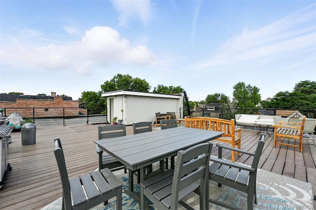 1045 N Clarkson St Unit 102, Denver, CO 80218 - wooden deck with outdoor dining space