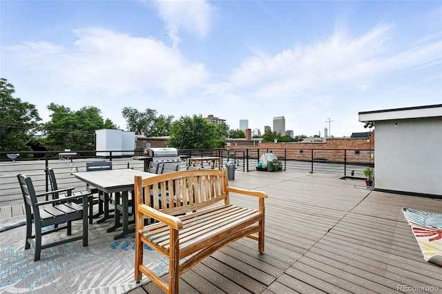 1045 N Clarkson St Unit 102, Denver, CO 80218 - wooden deck featuring area for grilling and outdoor dining area