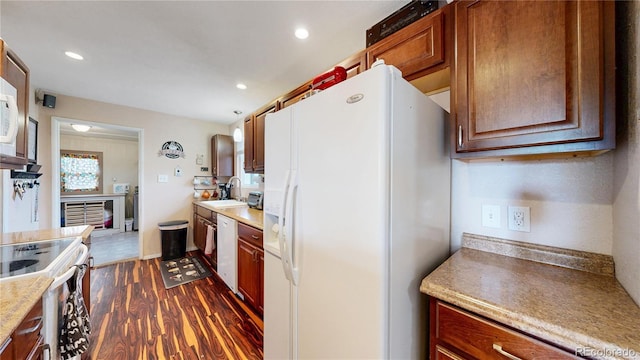 41 S Fenton St, Lakewood, CO 80226 - kitchen featuring white appliances, dark wood-style floors, light countertops, and recessed lighting