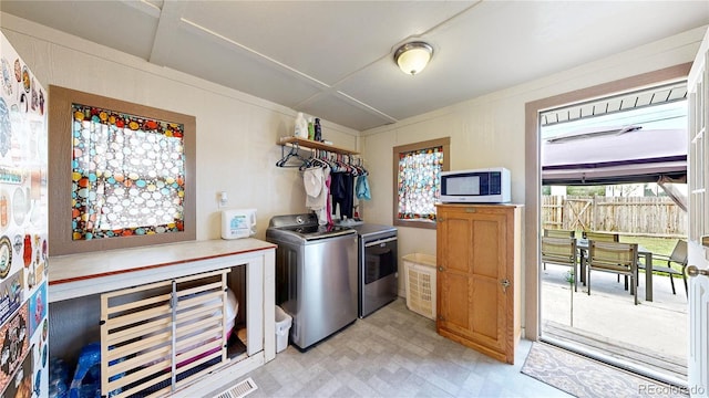 41 S Fenton St, Lakewood, CO 80226 - kitchen with washing machine and clothes dryer and light flooring