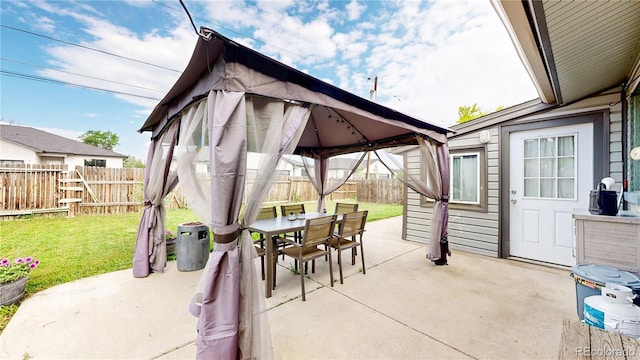 41 S Fenton St, Lakewood, CO 80226 - fenced backyard featuring a gazebo, outdoor dining area, and a patio