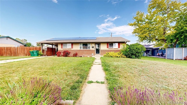 41 S Fenton St, Lakewood, CO 80226 - single story home featuring roof mounted solar panels and brick siding