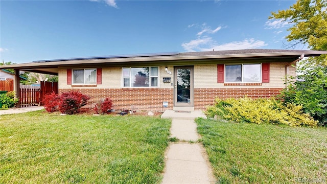 41 S Fenton St, Lakewood, CO 80226 - view of front of property featuring brick siding and solar panels