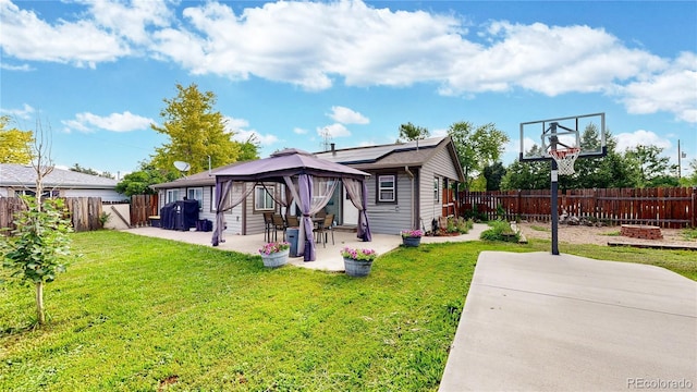 41 S Fenton St, Lakewood, CO 80226 - back of house with a gazebo, a patio area, and a fenced backyard