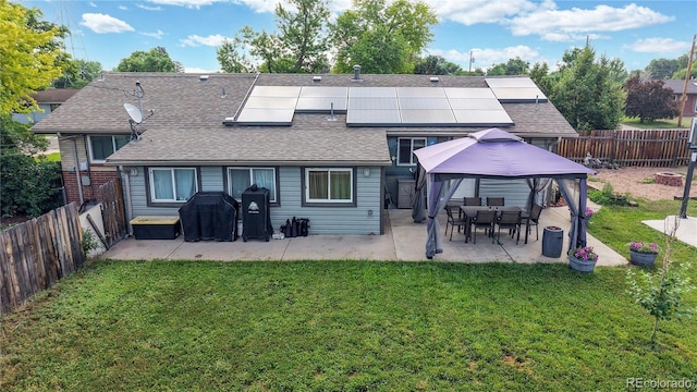 41 S Fenton St, Lakewood, CO 80226 - back of house with solar panels, a gazebo, a patio, and a shingled roof