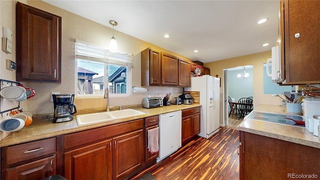 41 S Fenton St, Lakewood, CO 80226 - kitchen featuring white appliances, dark wood-style floors, light countertops, recessed lighting, and decorative light fixtures