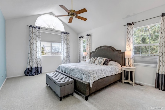 carpeted bedroom featuring ceiling fan, baseboards, and lofted ceiling