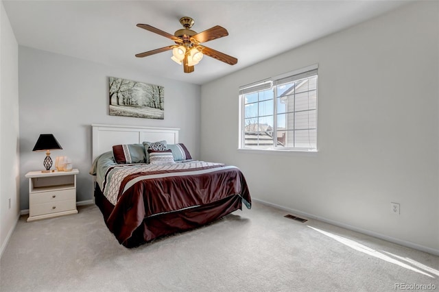 bedroom with visible vents, baseboards, and carpet