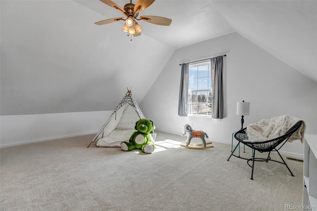 game room with visible vents, a ceiling fan, carpet flooring, and vaulted ceiling