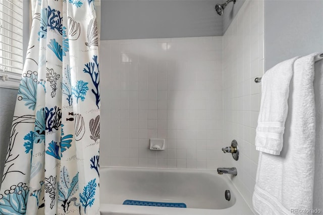 full bathroom with shower / bath combo with shower curtain