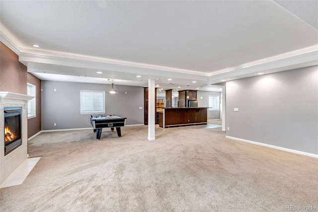 rec room featuring light carpet, recessed lighting, a fireplace, and baseboards