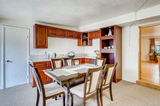 dining area with light carpet