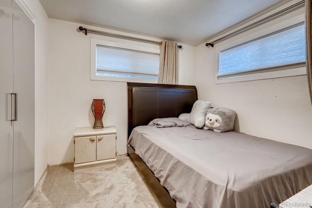 bedroom with light carpet