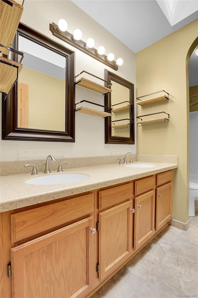 8376 Cobblestone St, Highlands Ranch, CO 80126 - bathroom with double vanity and toilet