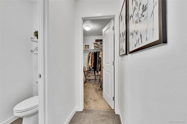 hallway featuring light carpet