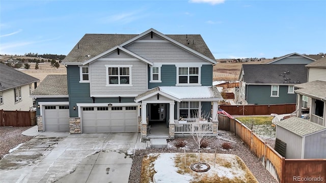 view of front of home with a porch and a garage