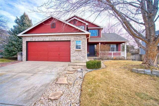 view of front of home with a front lawn, a porch, and a garage