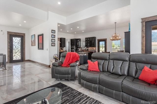 16985 County Road 306, Buena Vista, CO 81211 - living room featuring light marble finish flooring, a chandelier, and recessed lighting