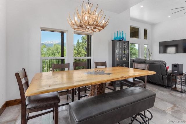16985 County Road 306, Buena Vista, CO 81211 - dining area with healthy amount of natural light, a chandelier, recessed lighting, and a high ceiling