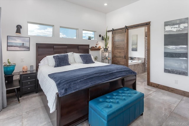 16985 County Road 306, Buena Vista, CO 81211 - bedroom featuring a barn door, ensuite bath, and recessed lighting