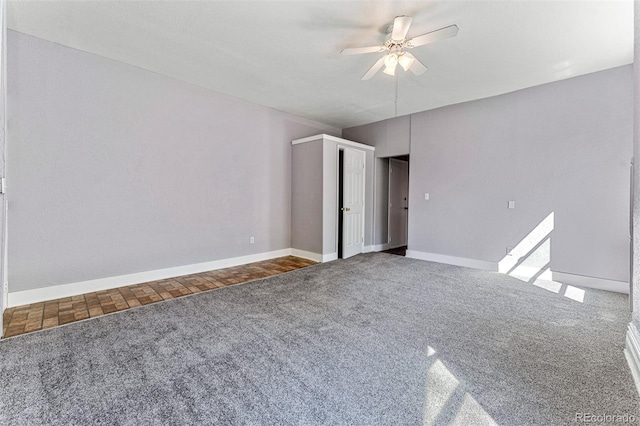 unfurnished bedroom featuring baseboards, a ceiling fan, and carpet flooring