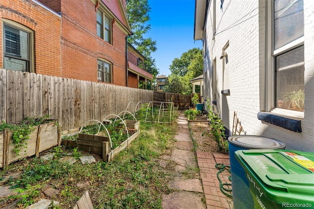 view of yard featuring a garden and fence