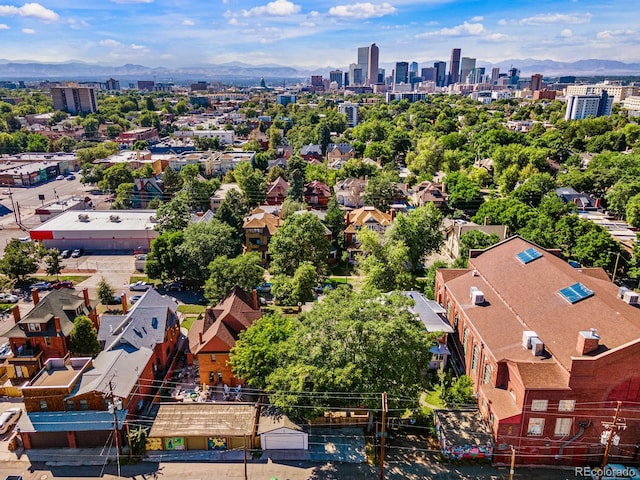 birds eye view of property with a city view and a mountain view