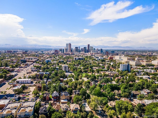 drone / aerial view with a mountain view and a city view