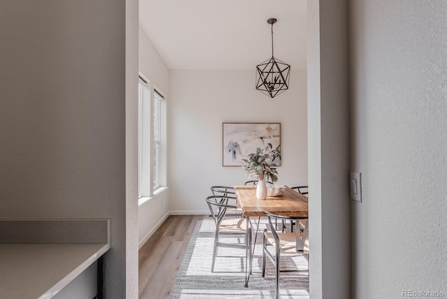 14345 Dahlia St, Thornton, CO 80602 - dining room featuring light wood-type flooring and baseboards