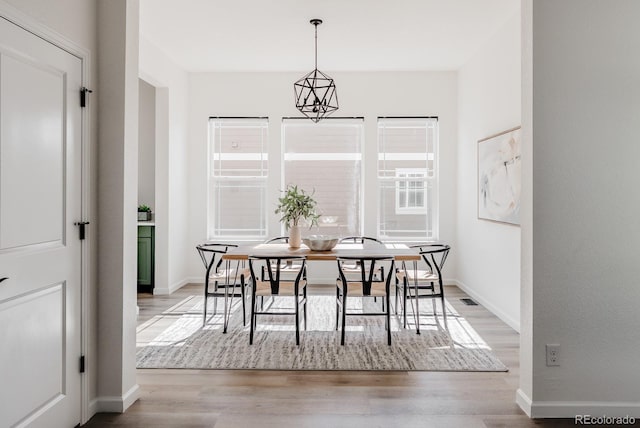 14345 Dahlia St, Thornton, CO 80602 - dining area with wood finished floors and baseboards