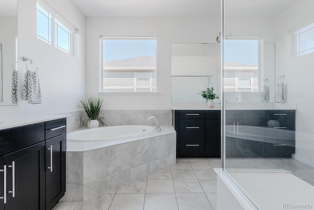 14345 Dahlia St, Thornton, CO 80602 - bathroom with vanity, a bath, and an enclosed shower