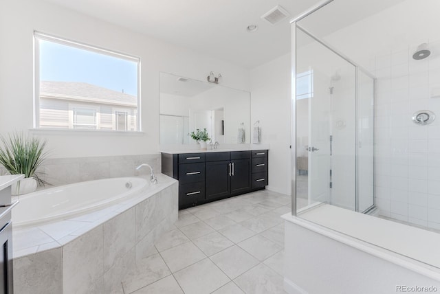 14345 Dahlia St, Thornton, CO 80602 - bathroom with vanity, a bath, a shower stall, and tile patterned floors