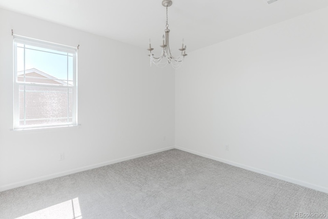 14345 Dahlia St, Thornton, CO 80602 - spare room featuring a chandelier and carpet