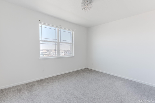 14345 Dahlia St, Thornton, CO 80602 - carpeted spare room featuring baseboards