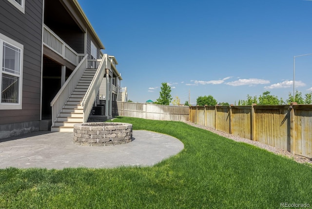 14345 Dahlia St, Thornton, CO 80602 - fenced backyard with stairs, an outdoor fire pit, and a patio