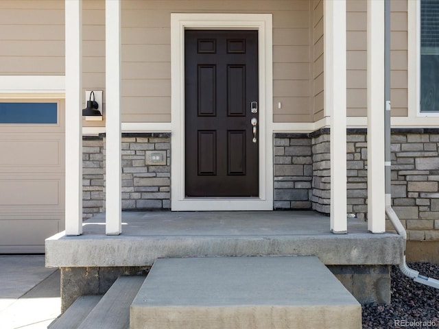 7324 27th Street Ln, Greeley, CO 80634 - property entrance with stone siding and covered porch