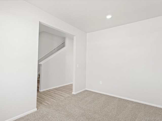 7324 27th Street Ln, Greeley, CO 80634 - unfurnished room featuring carpet flooring, baseboards, stairs, and recessed lighting