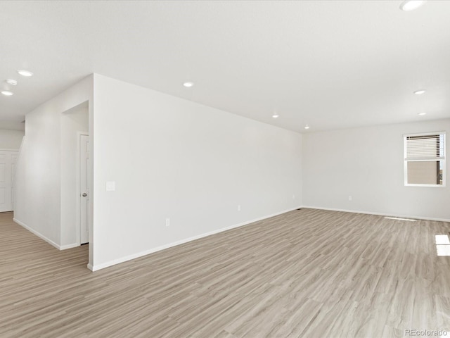 7324 27th Street Ln, Greeley, CO 80634 - empty room featuring light wood-type flooring, baseboards, and recessed lighting