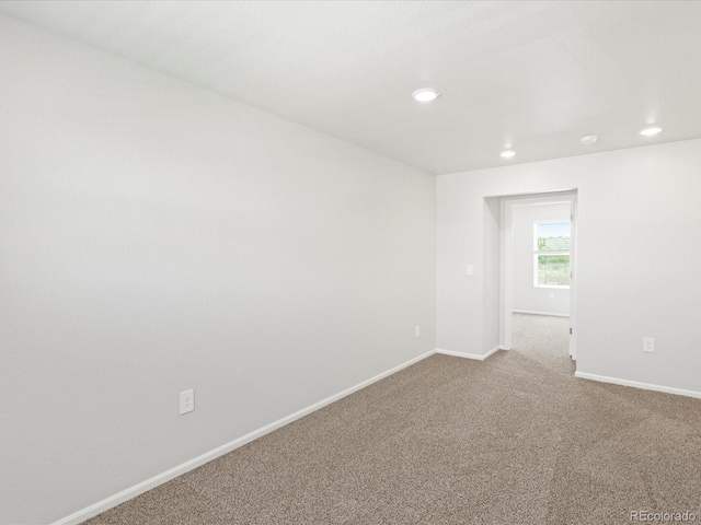 7324 27th Street Ln, Greeley, CO 80634 - spare room featuring baseboards, carpet flooring, and recessed lighting