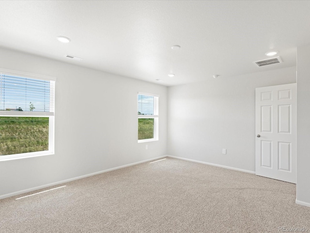 7324 27th Street Ln, Greeley, CO 80634 - carpeted spare room featuring baseboards