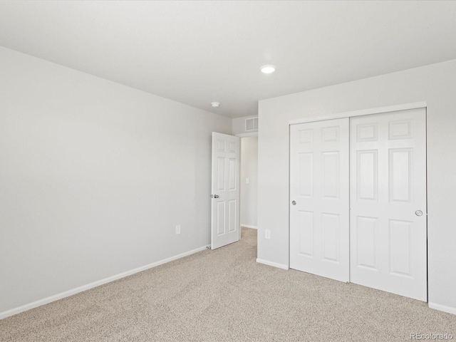 7324 27th Street Ln, Greeley, CO 80634 - unfurnished bedroom featuring light carpet, baseboards, a closet, and recessed lighting