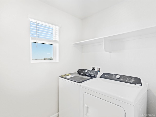 7324 27th Street Ln, Greeley, CO 80634 - laundry area featuring washing machine and dryer and baseboards
