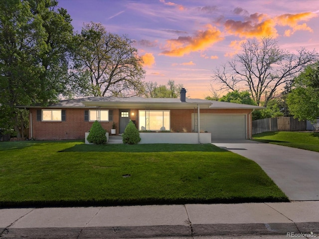 3560 S Glencoe St, Denver, CO 80237 - single story home featuring brick siding, an attached garage, driveway, and a chimney