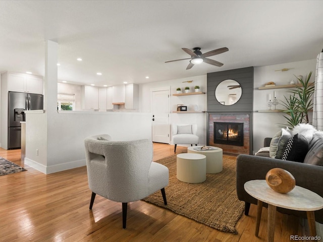 3560 S Glencoe St, Denver, CO 80237 - living area with a ceiling fan, a large fireplace, light wood finished floors, baseboards, and recessed lighting