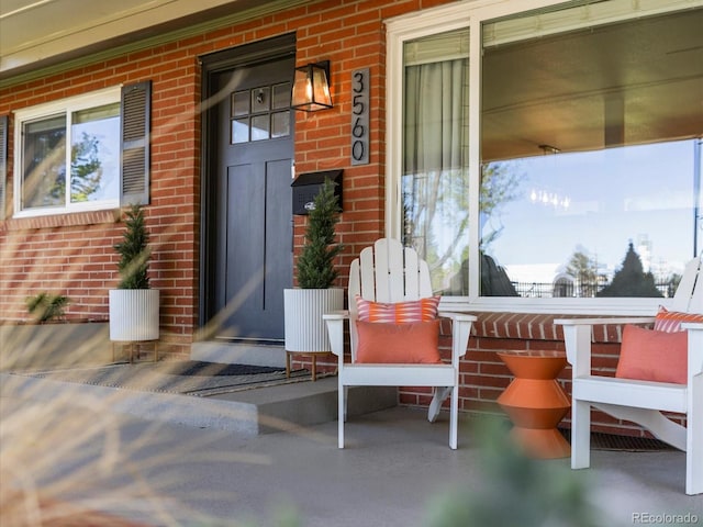 3560 S Glencoe St, Denver, CO 80237 - property entrance featuring brick siding and covered porch