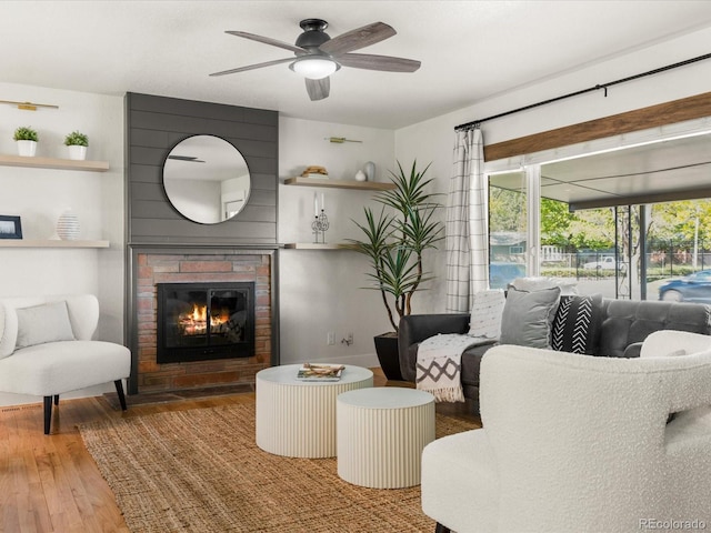 3560 S Glencoe St, Denver, CO 80237 - living room with a ceiling fan, wood finished floors, and a brick fireplace